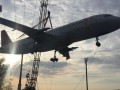 Crane carrying defunct AI aircraft crashes